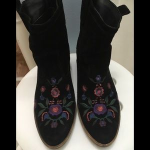 Black Aldo boots, or booties.